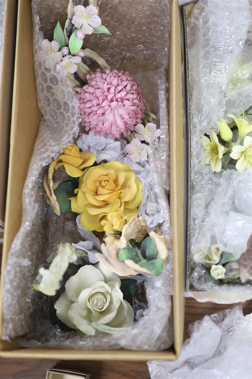 Twelve Boehm porcelain flower groups: No. 85 Chrysanthemum and Blossom, Pink Peony centrepiece and Iris silver shower, and a